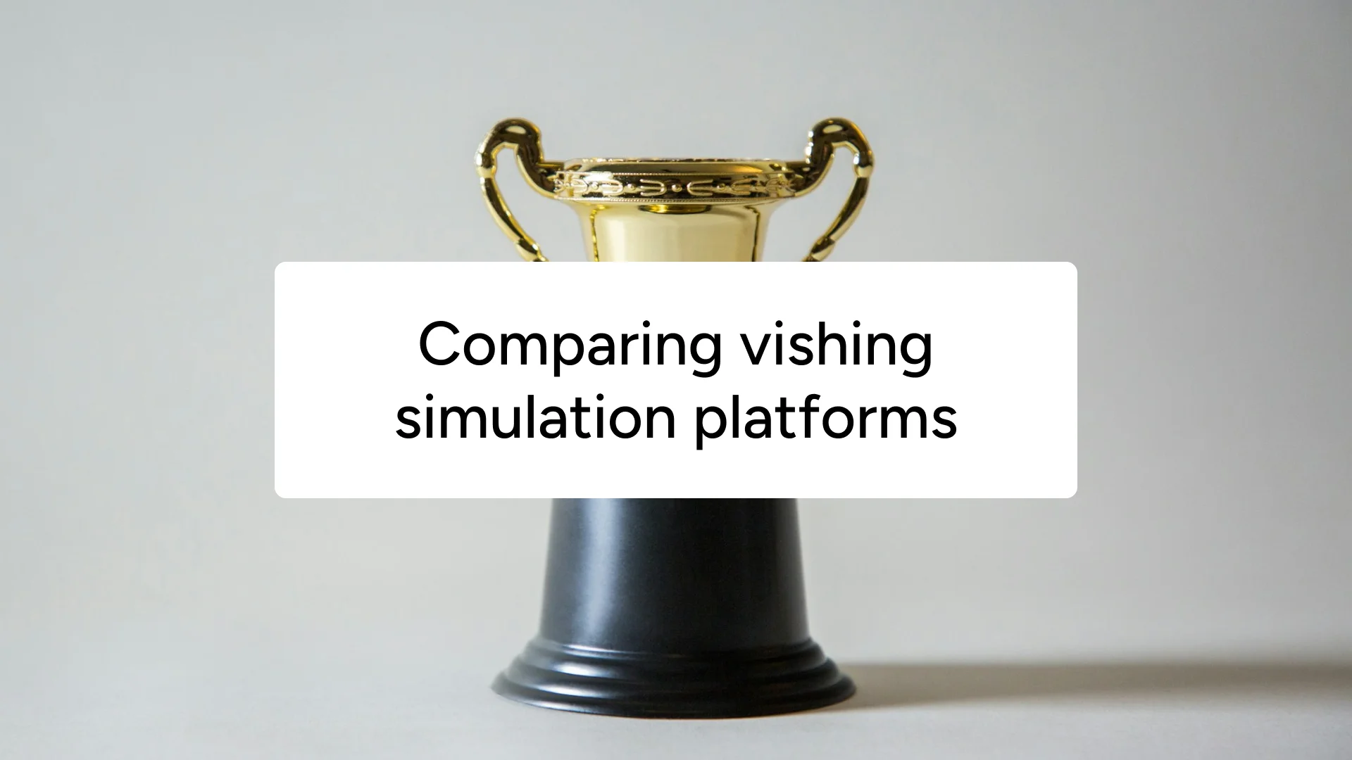 A gold trophy on a grey background, captioned 'Comparing vishing simulation platforms'.